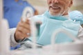 Senior patient having a cup with a mouthwash to rinse his mouth Royalty Free Stock Photo