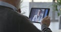 Senior patient having a video chat consultation with his doctor Royalty Free Stock Photo