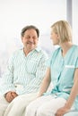 Senior patient in hospital with nurse Royalty Free Stock Photo