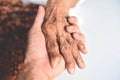 Senior patient and nurse - Pulse measurement by hand check the heart beat patient hand for a radial pulse by touching fingers Royalty Free Stock Photo