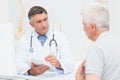 Senior patient sharing problems with doctor Royalty Free Stock Photo