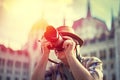 Senior pensioner tourist photographing in vintage style Royalty Free Stock Photo