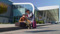 Senior pensioner tourists grandmother grandfather waiting boarding near international airport hall Royalty Free Stock Photo