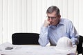 Senior pensive architect of engineer at a table Royalty Free Stock Photo