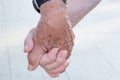 Senior People Elderly Couple Holding Hands Walking in the Street. Family Values Romantic Love Devotion Togetherness Fidelity Royalty Free Stock Photo