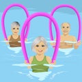 Senior people in fitness class doing aqua aerobics with foam rollers in swimming pool at leisure centre Royalty Free Stock Photo