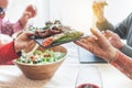 Senior people having italian vegan vegetarian lunch at home - Mature friends eating bbq vegetables,fresh salads and toasting red Royalty Free Stock Photo