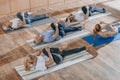 senior people with instructor stretching and exercising on yoga mats Royalty Free Stock Photo