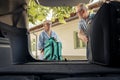 Senior people loading baggage in car trunk Royalty Free Stock Photo