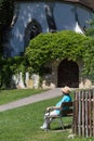 senior people relaxing in cloister park