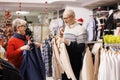 Senior people searching for jackets Royalty Free Stock Photo