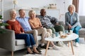 Senior people watching television in the living room Royalty Free Stock Photo