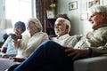 Senior people watching television together Royalty Free Stock Photo