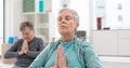 Senior people, yoga class and coach meditation, prayer and peace hands for exercise, holistic wellness and mindfulness Royalty Free Stock Photo