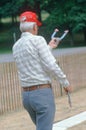 A senior playing a game of horseshoes Royalty Free Stock Photo