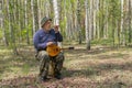 Senior playing music in birch forest Royalty Free Stock Photo