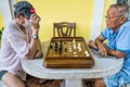 Senior playing thai chess at home at Bangkok, Thailand