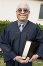 Senior Preacher in garden with Bible portrait Royalty Free Stock Photo