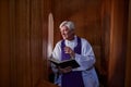 Priest talking to sinner during confession Royalty Free Stock Photo