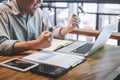 Senior professional man in casual wear working using laptop in cafe, business working connecting to wireless via computer Royalty Free Stock Photo