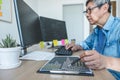 Senior Professional programmer working at developing programming and website working in a software develop company office, writing