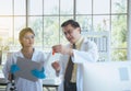 Senior professor teaching medical student for analyzing data research information together in the laboratary Royalty Free Stock Photo