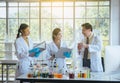 Senior professor teaching to medical student for analyzing data research information together in the laboratary Royalty Free Stock Photo