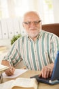 Senior professor working in his study