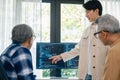 senior programmer bootcamlp,Asian young instructor guides senior learners through a programming on whiteboard, highlighting Royalty Free Stock Photo