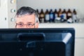 Senior researcher using a computer in the lab