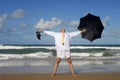 Senior retired business man arms outstretched enjoying retirement freedom on beach vacation Royalty Free Stock Photo