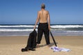 Senior retired business man undressed standing on a tropical beach, retirement freedom concept Royalty Free Stock Photo