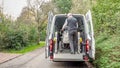 A senior retired man helping to transport disabled people