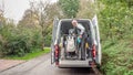 A senior retired man helping to transport disabled people