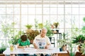 A retired man in casual clothes is concerned with reading a newspaper about COVID-19 news. While sitting at home. Royalty Free Stock Photo