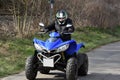 Senior rides a quad bike Royalty Free Stock Photo