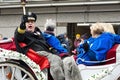 Senior royalty rides in carriage at winter carnival