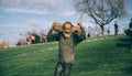 Senior runner carrying wooden logs in a test of extreme obstacle race