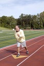 Senior running sports field running Royalty Free Stock Photo