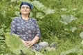 Senior 65s farmer woman at pumpkin garden home grown produce Royalty Free Stock Photo