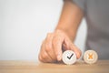 Hand choose correct sign on circle wood on desk for changing mindset , idea of positive thinking and change of mind