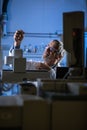 Senior scientist in a chemistry lab carrying out research - looking at gas chromatography samples Royalty Free Stock Photo