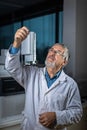 Senior scientist in a chemistry lab carrying out research - looking at gas chromatography samples Royalty Free Stock Photo