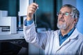 Senior scientist in a chemistry lab carrying out research - looking at gas chromatography samples Royalty Free Stock Photo