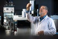 Senior scientist in a chemistry lab carrying out research Royalty Free Stock Photo