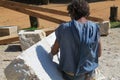 Senior sculptor works on stone sculpture