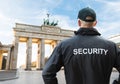 Senior Security Officer Standing In Front Of Brandenburg Gate Royalty Free Stock Photo