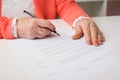 Senior signing papers at the office Royalty Free Stock Photo