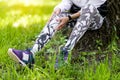 Senior slim lady resting in summer park after running Royalty Free Stock Photo