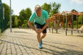 Senior sportsman suffering with knee having injury during workout